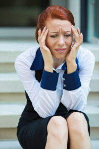 Woman looking frazzled and worried