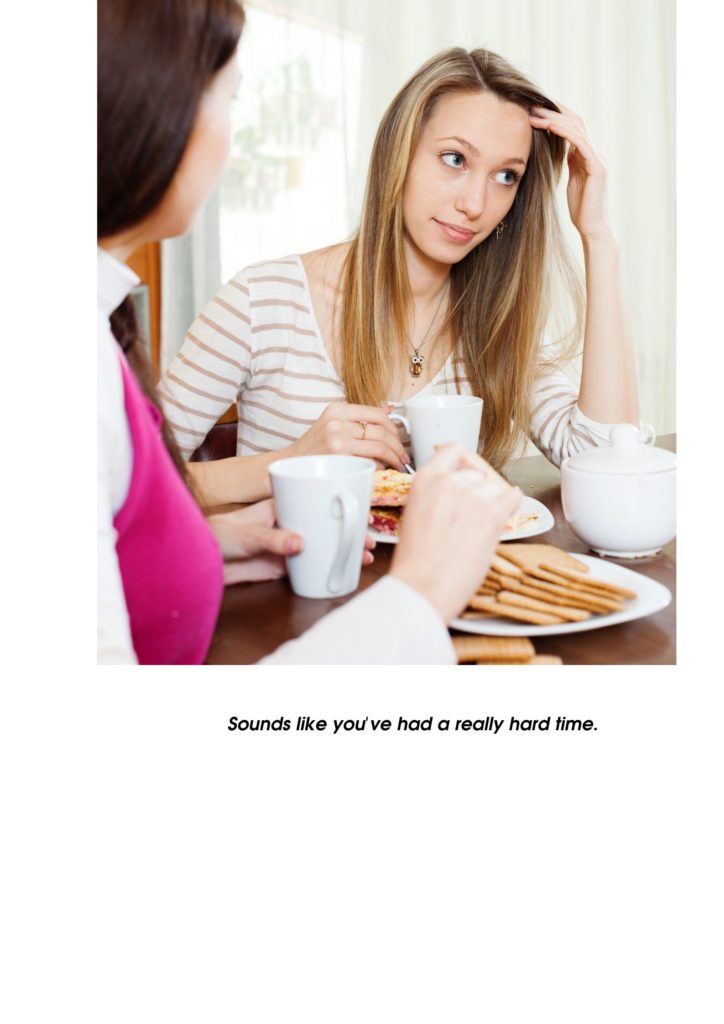 Two female friends having coffee. One looks like she is sharing a problem.